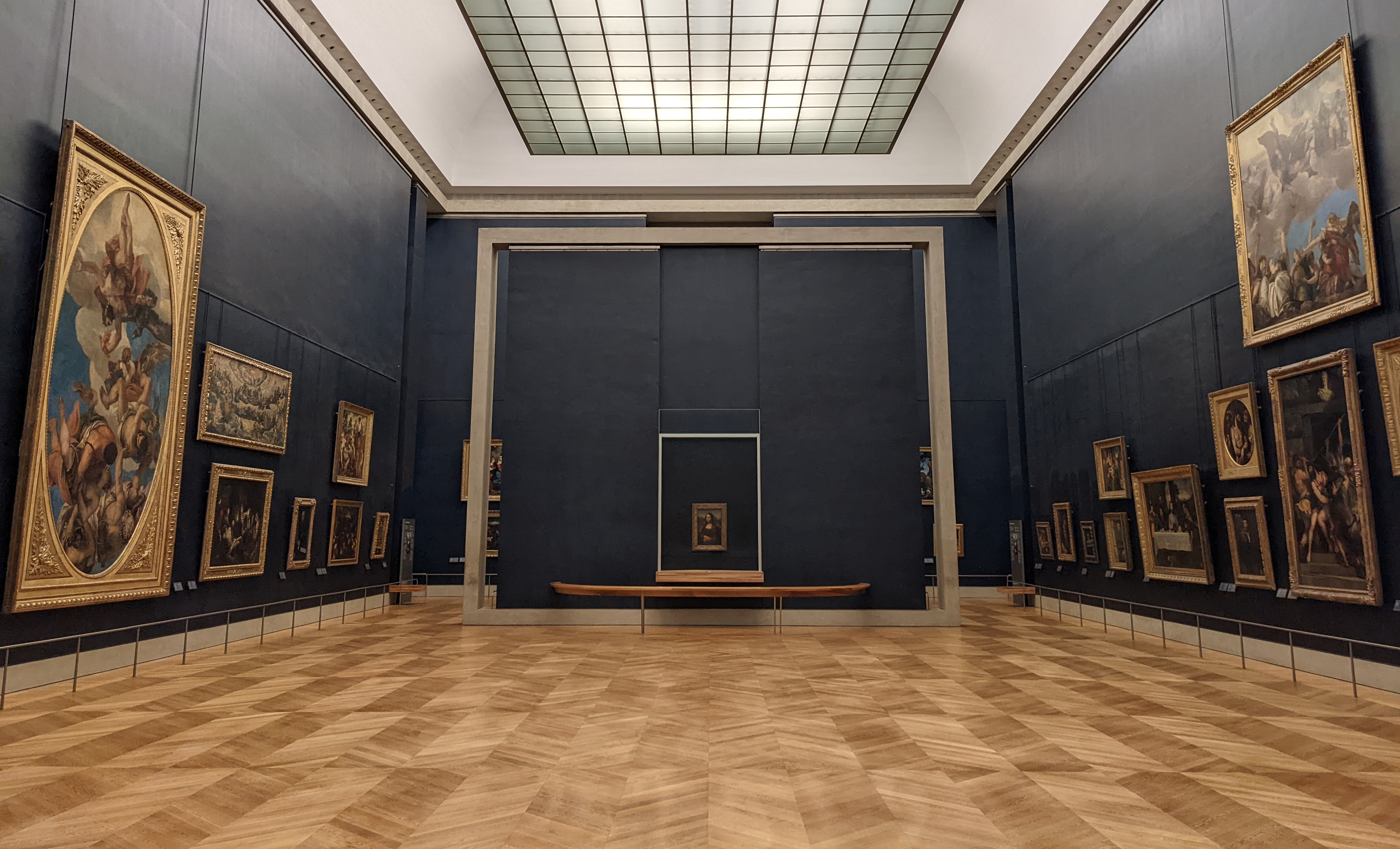 The Mona Lisa displayed in the Salle des États after the Louvre room renovation